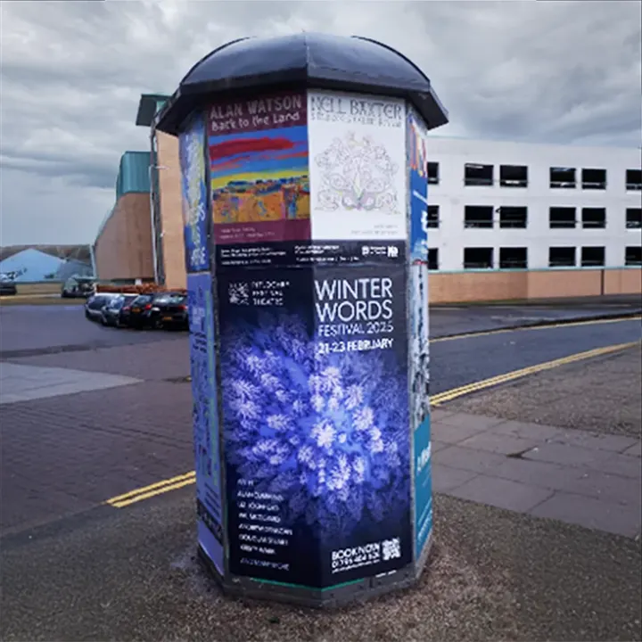 A 'Winter Words Festival 2025' poster on a street column, 21 to 23 February
