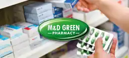 The M&D Green Pharmacy Logo on top of hands stocking pills in a pharmacy