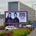 A digital billboard advertisement for Oasis live '25. The screen features a black-and-white photo of Liam and Noel Gallagher and lists dates for Scottish Gas Murrayfield Stadium on 8th and 9th August.