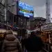 A large digital billboard advertising Calvin Harris concerts above the Tesco at the Glasgow Christmas market outside the St Enochs Centre.