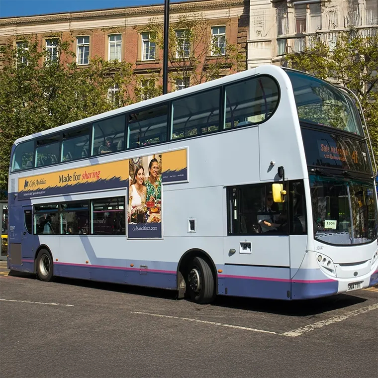 A Glasgow double-decker bus with a Cafe Andaluz 'Made for sharing' advert on its side