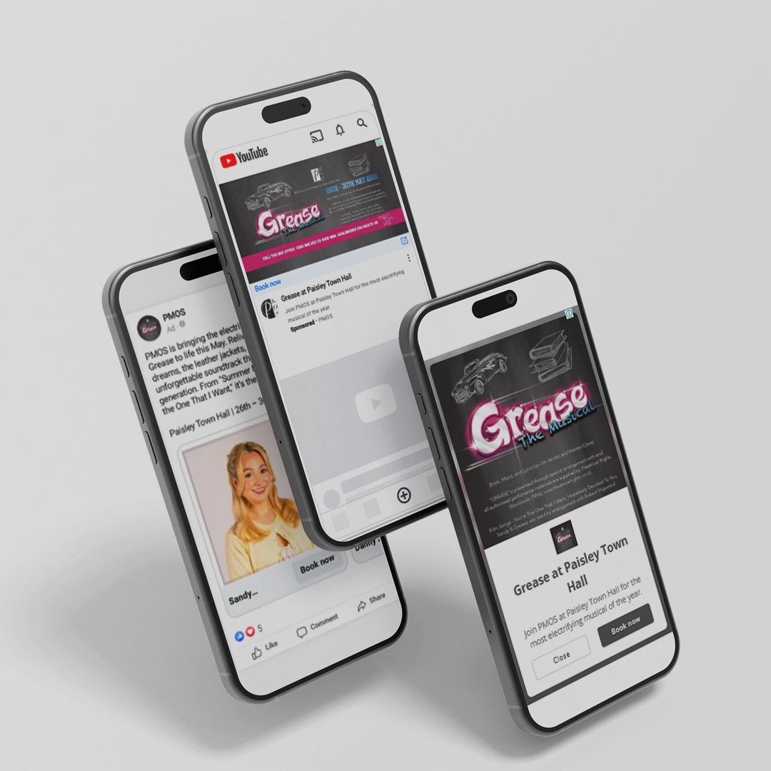 Three phones showing 'Grease the Musical' adverts on YouTube and Facebook