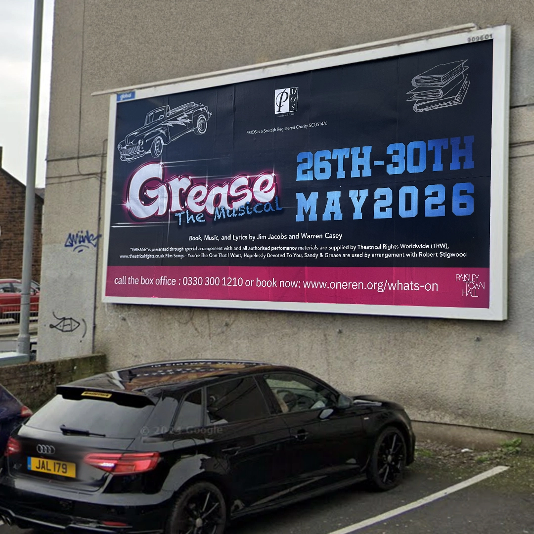 A 'Grease the Musical' billboard above a car park: 26th to 30th May 2026