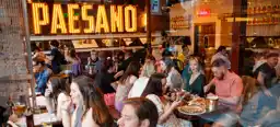 The official opening of the new Paesano Pizza branch in the Southside, filled with people enjoying their food and drinks
