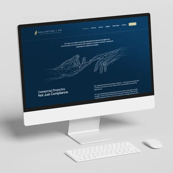 Ballantyne & Co website on a desktop computer: 'Commercial Perspective, Not Just Compliance.'
