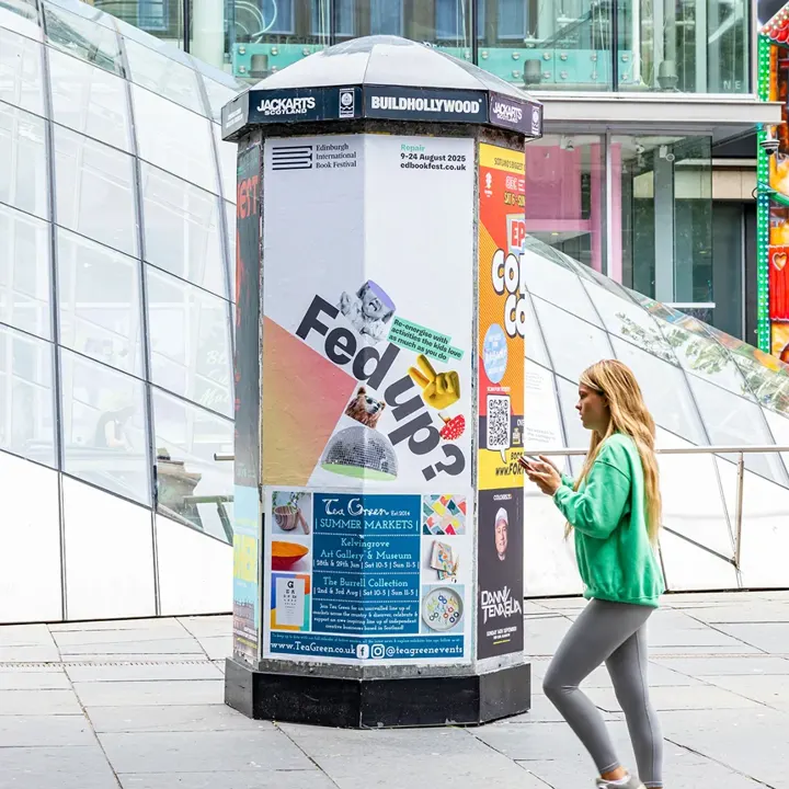 A city display pillar featuring an Edinburgh International Book Festival banner with the bold text Fed Up? and playful graphics.