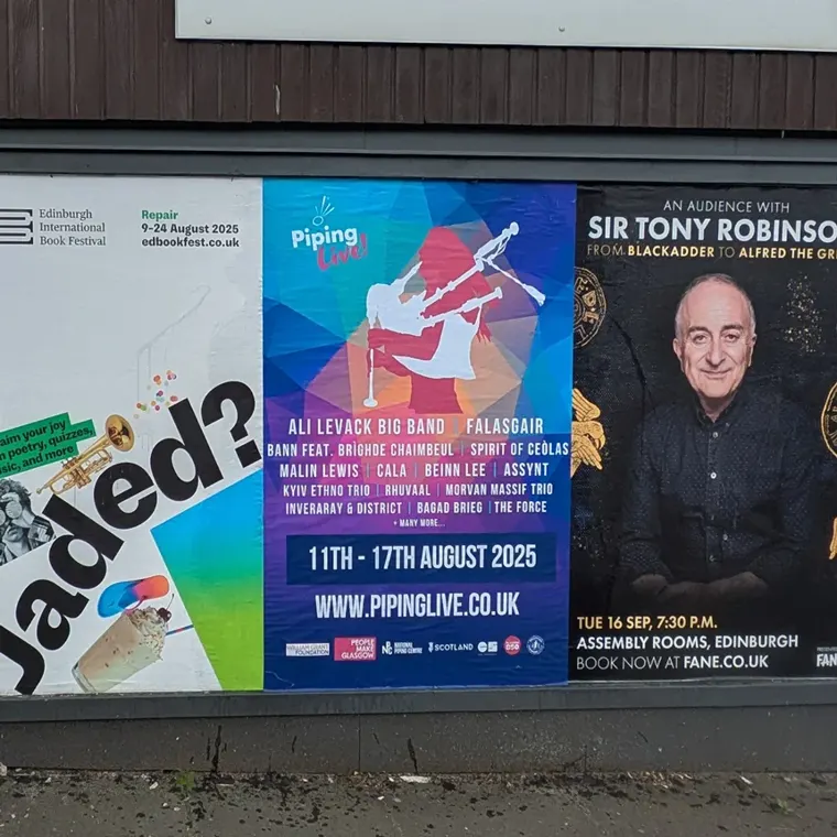 A Piping Live! 2025 poster on a street hoarding, 11th to 17th August 2025