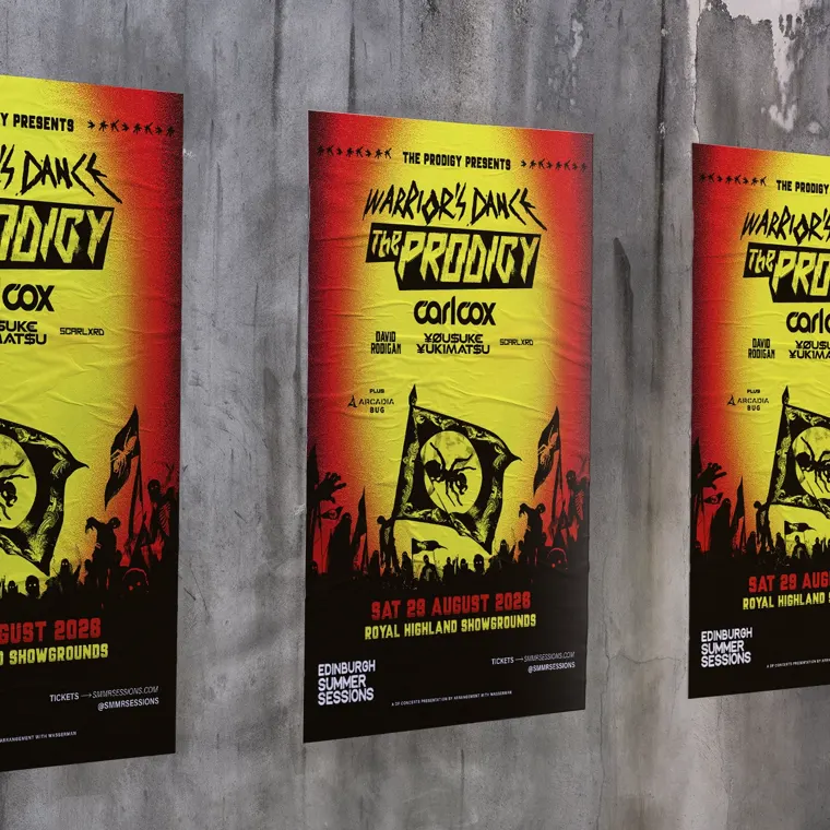 Three street posters on a concrete wall advertising The Prodigy and Carl Cox for the "Warrior’s Dance" show in 2026 in Edinburgh.
