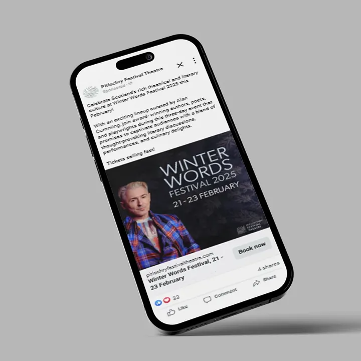 A phone showing a Pitlochry Festival Theatre Facebook advert for 'Winter Words Festival 2025'
