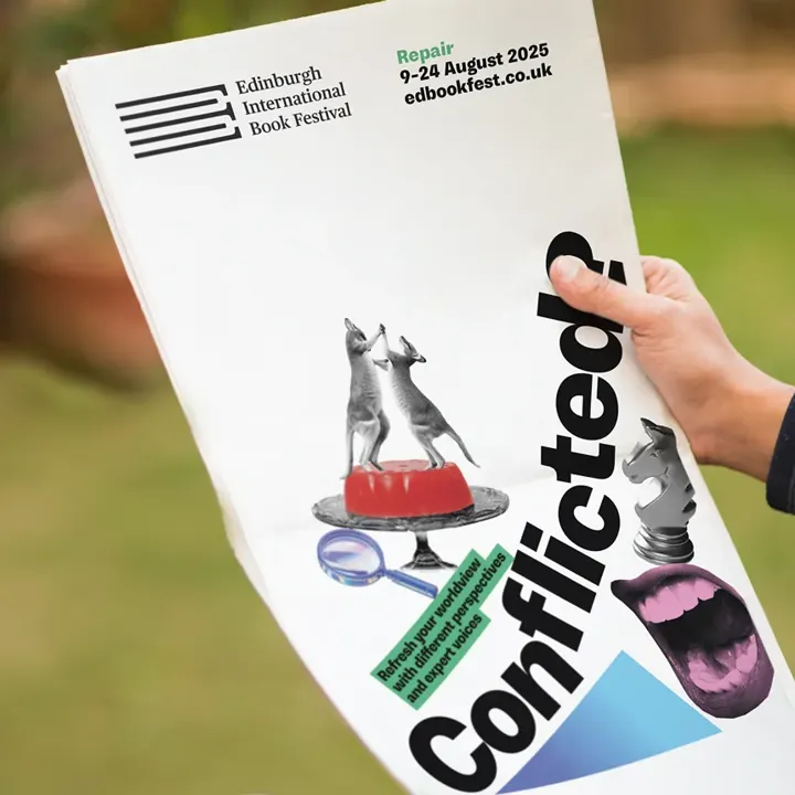 A person holding a poster for the Edinburgh International Book Festival, featuring the word Conflicted? alongside a collage of images on the poster.