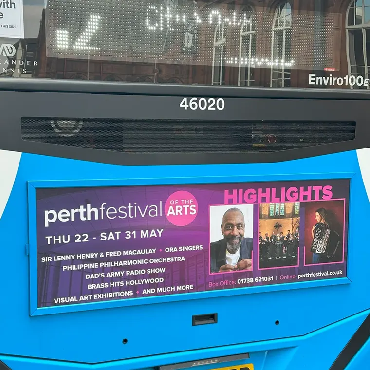 The back of a bus with a Perth Festival of the Arts advert for festival highlights, Thu 22 to Sat 31 May