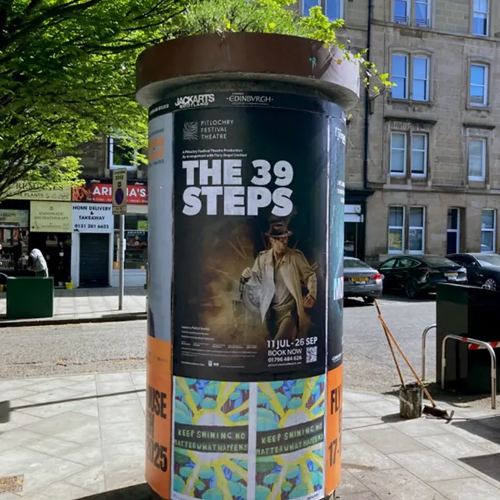 A Pitlochry Festival Theatre 'The 39 Steps' poster on a street column