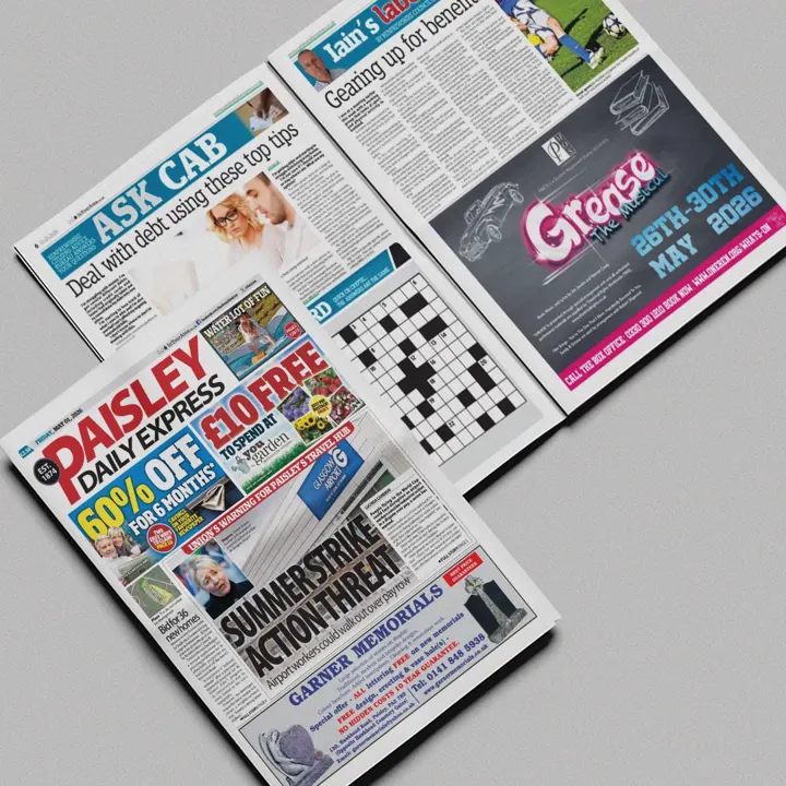A Paisley Daily Express newspaper open at a 'Grease the Musical' advert